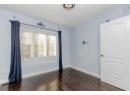 Empty room with dark wood-type flooring and a textured ceiling