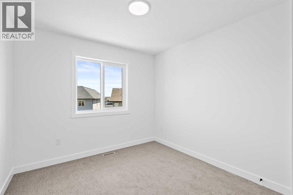 66 Heritage Circle, Cochrane, Alberta  T4C 3G9 - Photo 26 - A2248771