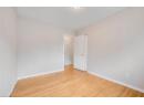 Spare room featuring wood finished floors and baseboards