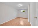 Empty room with light wood-style floors and crown molding