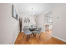 Dining area with a chandelier and light wood-style floors