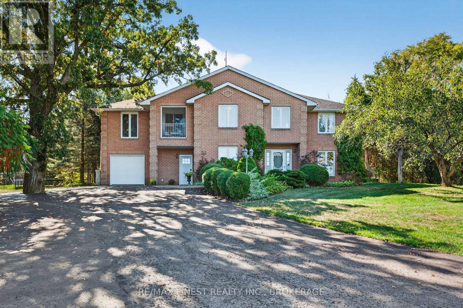 Welcome to 1548 County Road 9 in Greater Napanee, Ontario! This beautiful property is set down a long, winding driveway where you find a home that feels like its own private retreat. Tucked away on almost three acres of peaceful countryside, this property offers the perfect blend of comfort, recreation, and tranquility. At the heart of the outdoor space is an incredible 20 x 40 in-ground pool, a true showpiece surrounded by lush greenery and seating areas lined with umbrellas. A pergola draped in grapes creates the perfect shaded spot for summer afternoons, while the pool house, complete with a change room and two-piece bathroom, makes entertaining effortless. Whether it is hosting friends or enjoying a quiet swim at sunset, this backyard is designed for memories. The home itself is equally inviting, offering 4 spacious bedrooms and 3.5 bathrooms.  A bright and welcoming layout flows into a huge recreation room with a home gym, providing space for both relaxation and activity. Every detail has been thoughtfully designed to balance everyday living with the comforts of retreat style amenities including in-floor radiant heat, and a new electric heat pump as well as propane available as a back up source of heat. Practicality is built in with an attached two car garage for daily convenience, plus a detached garage workshop, perfect for hobbies, storage, or extra toys. This is more than just a home  its a lifestyle. A place where every drive up the lane feels like an escape, every gathering feels special, and every day offers the peace of country living with all the modern touches you could want. (id:48254)