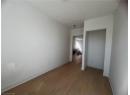 Unfurnished room featuring wood finished floors and baseboards