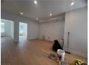 Unfurnished room with light wood-type flooring, recessed lighting, and radiator