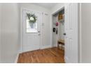 Mudroom featuring wood finished floors and baseboards