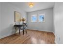 Bedroom featuring wood finished floors and baseboards