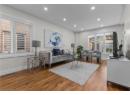 Living room with wood finished floors and recessed lighting