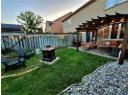 Fenced backyard featuring a pergola, a patio area, and an outdoor hangout area