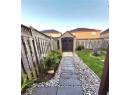 Fenced backyard featuring a patio, a gate, and a pergola