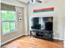 Detailed view of wood finished floors and a ceiling fan