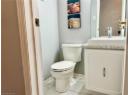 Bathroom with tile patterned floors and vanity