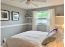 Bedroom featuring a textured ceiling and a ceiling fan