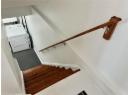 Stairs with washer / clothes dryer and carpet flooring