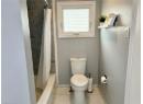 Full bath with toilet and shower / bath combo