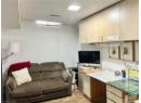 Living area featuring a textured ceiling