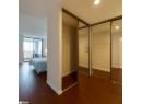 Bedroom featuring dark wood finished floors, recessed lighting, and two closets
