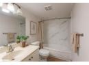 Full bathroom featuring shower / bath combo, vanity, and tile patterned floors