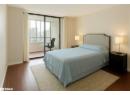 Bedroom featuring wood finished floors and access to exterior