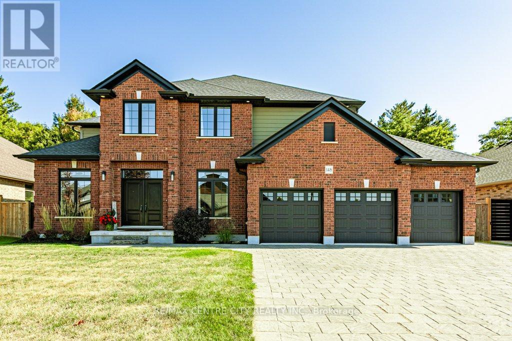 148  Elliott Trail  Thames Centre (Thorndale), Ontario 148 Elliott Trail, a stunning red-brick home located in the desirable Trails of Wye Creek neighbourhood in Thorndale, Ontario. This inviting 4 bed, 4 bath home boasts over 4000 sq. feet with a 3 car garage, perfect for those with multiple vehicles. Prepare to be captivated by the large family room, boasting a cozy gas fireplace and beautiful views through expansive windows that overlook your personal backyard paradise. The open-concept layout effortlessly blends socializing and functionality with the well-appointed kitchen, complete with ample storage, large counter space, and a convenient eat-in island. The main floor conveniently accommodates a laundry area. Upstairs, three out of the four bedrooms offer spacious walk-in closets, while the fourth bedroom features a charming alcove perfect for creating a separate workspace. The primary bedroom boasts its very own private 4-piece ensuite. Venture downstairs to discover a fully finished recreational space, complete with an elegant bar area. A finished den offers endless possibilities as a playroom, home gym, or whatever suits your imagination. With the powder room and three additional storage spaces, there's no need to clutter up your 3-car garage with miscellaneous items. Outside, revel in the delights of the fully fenced yard, where you can luxuriate in the allure of the in-ground pool or unwind by the cozy fire pit. For those in need of extra storage or workspace, a handy shed awaits your convenience. (id:48254)