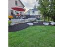View of yard featuring fence and a patio area