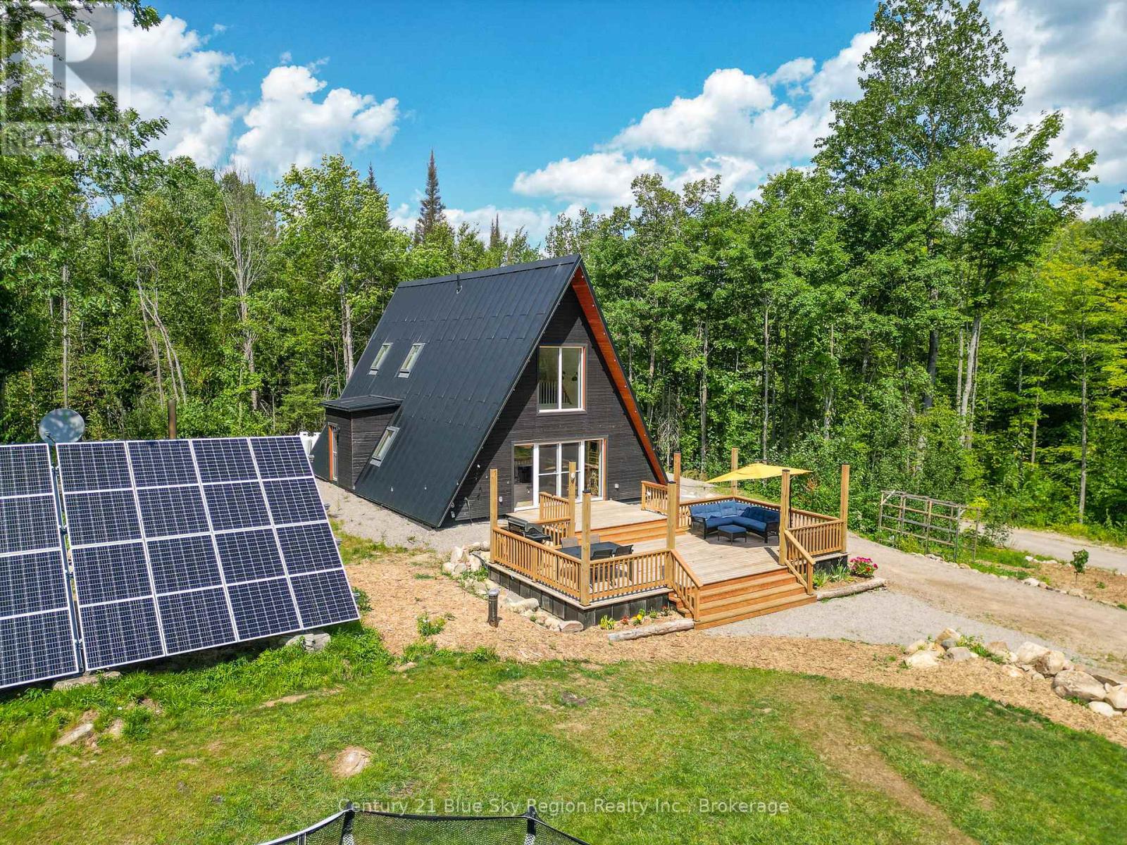 Motivated Sellers This newly, custom-built European A-Frame sits on 90 acres of mixed hardwood forest, backing onto crown land that connects to Algonquin Park. Located 30 minutes from North Bay, this off-grid haven is a dream for nature lovers and homesteaders alike. Crafted with European eco-friendly materials and pristine carpentry, this home features triple-pane tilt-turn windows, heavy-duty interior doors, and a triple-deadbolt front door. The 14" thick walls, HRV system, and slab-on-grade design ensure exceptional air-tightness and energy efficiency. South-facing windows optimize passive solar heating in winter, while the north-side bedrooms stay cool in the summer. Enjoy the comfort of modern off-grid living without any sacrifices with this highly efficient new home and large solar system that supports all major home appliances without costly utility bills. Featuring a brand-new, state-of-the-art 13kw standby quiet home Cummins generator that kicks on automatically as needed. When the propane boiler is used to heat the in-floor system, annual utilities including the propane generator and propane stove total $1200 altogether. When the outdoor wood boiler is used, burning dead-fall from the property, propane is only used for the cooking propane stove and generator, totaling $300-500 per year (depending on your usage). These are your only utility bills. Designed for sustainable living, the property includes gardens, a fruit orchard (apple, pear, plum, hazelbert), a chicken coop, and livestock shelter.  A winding 1,000 ft driveway recently topped with A-gravel leads to a private setting with a seasonal waterfall, pond, and exposed moss-covered bedrock. Explore 3 km of established trails, several hunting blinds, and a 15x23 cabin with a sugar shack, generator shed, and outhouse. The land attracts moose and deer annually.  Built in 2023, with 2025 updates including: whole-home generator, eco/zero VOC floors and trim, upstairs bath, new fridge, deck, and landscaping (id:48254)