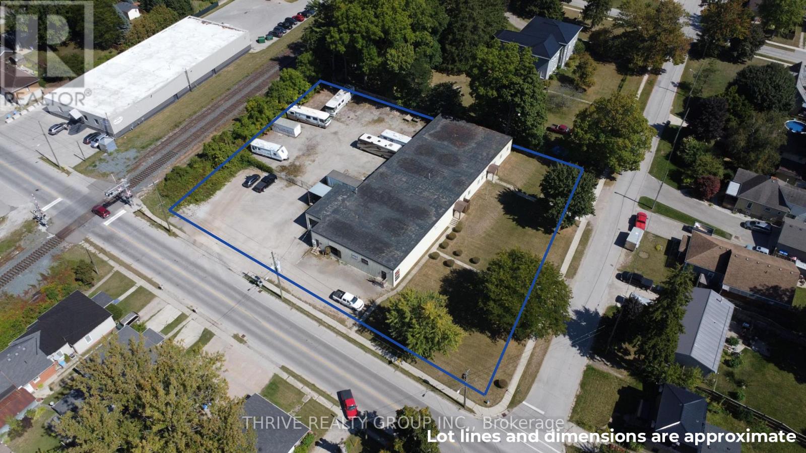 125  Victoria Street  Strathroy-Caradoc (NW), Ontario 125 Victoria St, an approx. 10,650 Sq Ft freestanding commercial building located on 1.1 acres in Strathroy. The building includes 1,650 Sq Ft of office space with the remaining 9,000 Sq Ft allocated to warehouse/light industrial use with a clear height of 10'8 to the bottom of the ceiling joist. The building includes a receiving area with a 12'x9'8 grade level overhead door and a 7'9x7'8 truck height overhead door. Located on the property to the north of the building is an approx. 115'x100' fenced parking/storage yard. (id:48254)