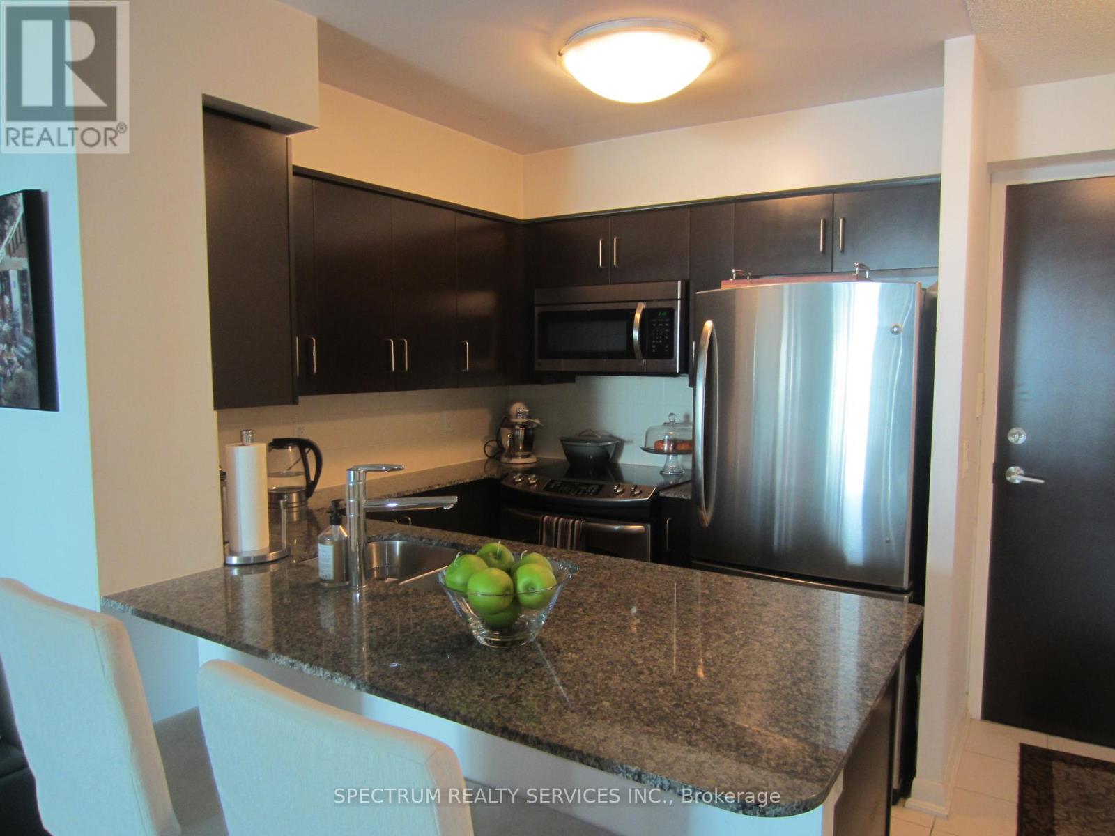 708 - 215 Sherway Gardens, Toronto, Ontario  M9C 0A4 - Photo 2 - W12420997