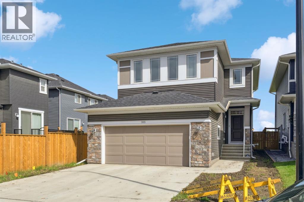335 Creekside Way Sw, Calgary, Alberta  T2X 5B2 - Photo 2 - A2244221