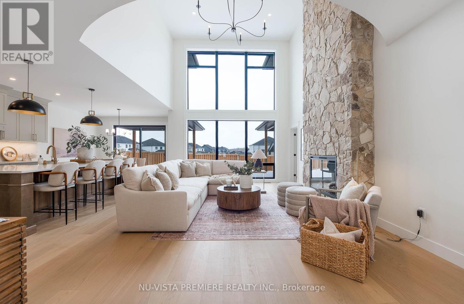 Lot 14  Harvest Lane  Thames Centre, Ontario TO BE BUILT! This stunning 3,375 sq. ft. modern farmhouse from Richfield Custom Homes perfectly blends warmth, luxury, and functionality. Located in the highly sought-after Boardwalk at Millpond community in Dorchester, this model home showcases top-tier craftsmanship, thoughtful design, and premium finishes throughout. Step inside to soaring 18-ft ceilings in the great room, where floor-to-ceiling windows bathe the space in natural light. The gourmet kitchen is a chefs dream with tons of storage and a butlers pantry that flows seamlessly into the dining room. The dining room is designed to impress, featuring soaring ceilings that create an open, airy atmosphere perfect for hosting intimate family dinners or grand celebrations. Thoughtfully placed windows allow natural light to cascade in, enhancing the home's inviting warmth and elegance. The main-floor primary suite is a true retreat, featuring two walk-in closets, a spa-inspired 5-piece ensuite, and direct access to the optional expansive covered back deck perfect for morning coffee or evening relaxation. Upstairs, four generously sized bedrooms offer incredible comfort. A secondary primary suite boasts its own 5-piece ensuite and walk-in closet, while two additional bedrooms share a Jack-and-Jill bath. The fifth bedroom enjoys its own private 3-piece ensuite, ensuring ultimate convenience for family and guests. Richfield Custom Homes specializes in crafting one-of-a-kind residences tailored to your lifestyle. Whether you're looking for modern elegance, timeless charm, or something in between, well bring your vision to life with exceptional craftsmanship and premium finishes. With exclusive lots available in Boardwalk at Millpond, now is the time to build the home you've always dreamed of. Don't miss your chance to own this exceptional model home or start planning your custom dream home today! (Photos from previous model) (id:48254)