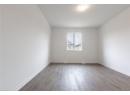 Empty room featuring light wood-style flooring and baseboards