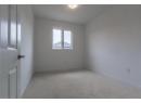 Unfurnished room with light carpet and baseboards