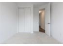 Unfurnished bedroom with carpet floors and a closet