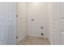 Laundry room with hookup for a washing machine and electric dryer hookup