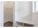 Mudroom with dark wood-style floors and baseboards