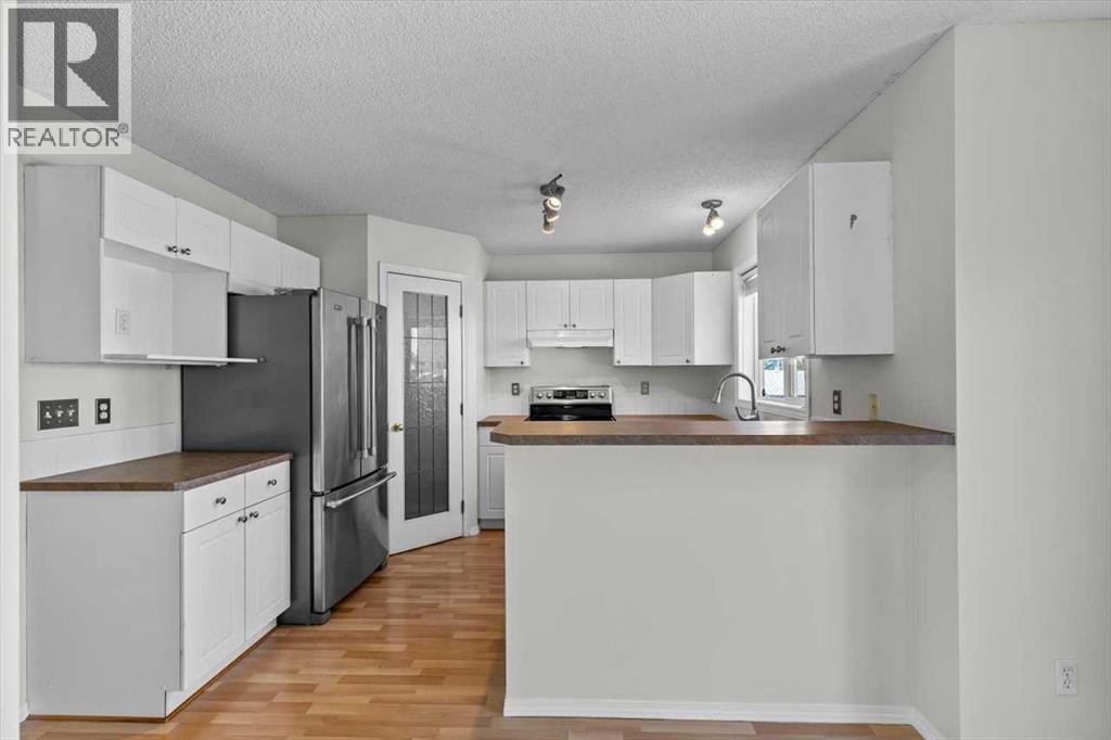 911 Arbour Lake Road Nw, Calgary, Alberta  T3G 4Z9 - Photo 8 - A2259679
