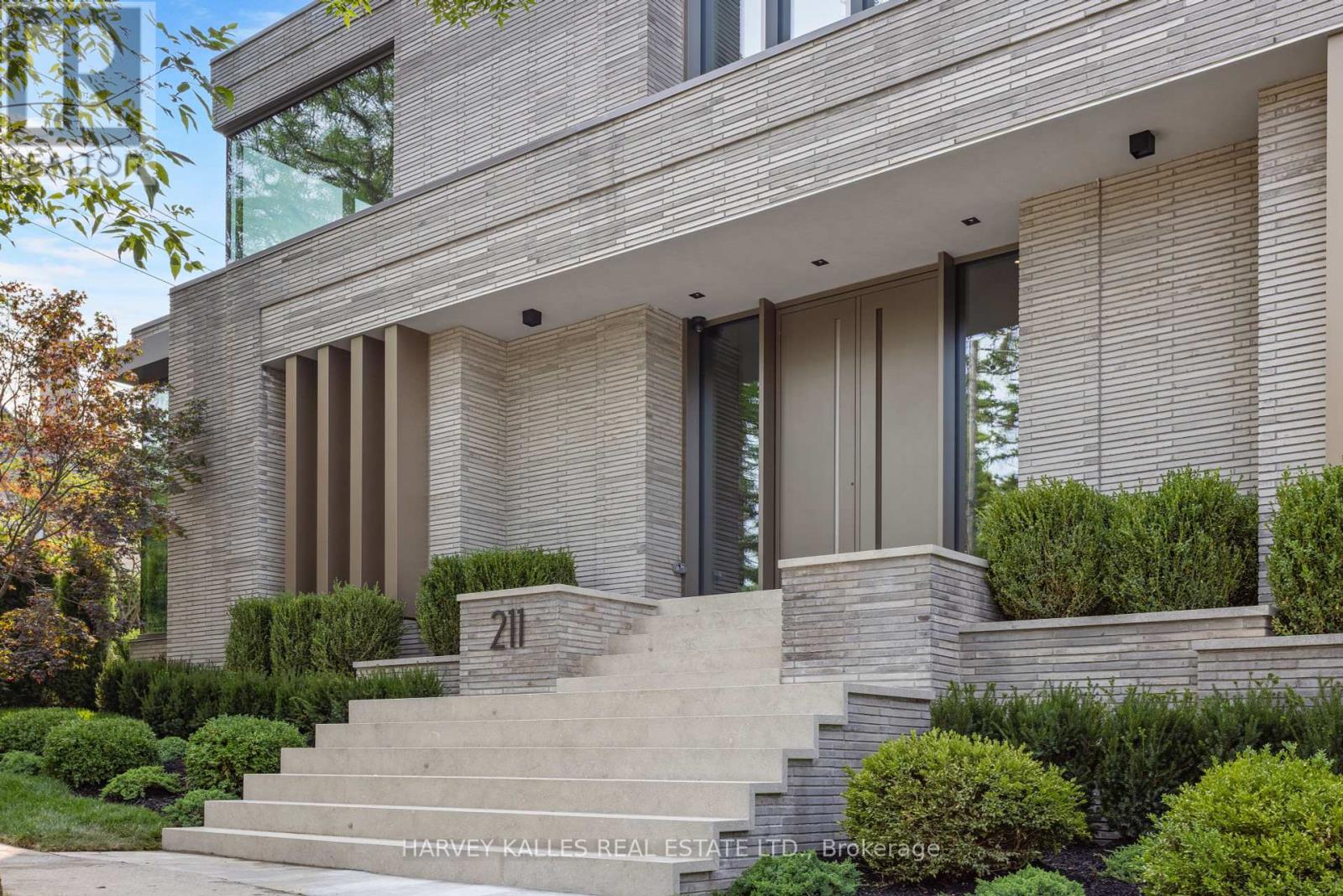 Welcome To 211 Dunvegan Rd, A Masterpiece Of Modern-Transitional Living Crafted By Omid Taba And Forest Range Developments. This Bespoke Residence Sits On A Generous Corner Lot, Offering 6,972 Sq. Ft. Above Ground Plus 2,884 Sq. Ft. In The Lower Level. Every Detail Reflects Precision, Innovation, And Refined Craftsmanship, Merging Architectural Drama With Timeless Elegance. From The Serene Gallery-Like Foyer, Sightlines Lead To The Dramatic Double-Height Family Room, Where Floor-To-Ceiling Glazing, Sculptural Lilac And Calacatta Viola Marble, And Custom Vertical Wood Panels Create An Atmosphere Both Bold And Inviting. A Seamless Flow Connects The Kitchen With Dual Marble-Topped Islands And Fully Integrated Sub-Zero, Wolf, And Miele Appliances To The Dining Area, Anchored By A 12-Seat Custom Marble Table Beneath Henges Superb All Chandelier. Additional Living Zones Include A Warm Living Room With Sky White Marble Fireplace, A Refined Study, And A Moody Lower-Level Lounge With Gym, Theatre, Bar, And Glass-Enclosed Cooled Wine Cellar. The Primary Suite Features A Suspended Fireplace, His-And-Hers Boutique Dressing Rooms, And A Spa-Like Ensuite With Cocoon Fixtures, Freestanding Tub, Steam Shower, And Heated Floors. Four Additional Bedroom Suites Plus Nannys Suite And A Third-Floor Sitting Area With Kitchenette Ensure Space And Privacy For Family And Guests. An Elevator Provides Access Across All Levels, While Radiant Heated Floors, Smart Home Automation, And Integrated Lighting And Climate Systems Offer Modern Comforts. Outdoors, A Walk-Out Terrace Features Covered BBQ, Dining And Lounge Seating Centered Around A Sculptural Firepit Above A Reflecting Water Basin With Cascading Water Into A Lower Pond. Beyond, A Resort-Style Pool And Jacuzzi With Lush Landscaping Create A Private Retreat For Relaxation And Entertainment. Artistry And Innovation Converge To Deliver A Residence Of Unparalleled Sophistication, Lifestyle, Comfort, And Timeless Design. (id:48254)