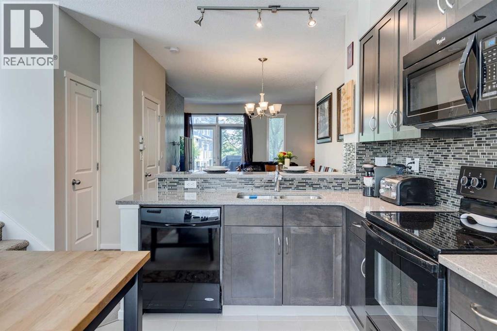 8 Kinlea Common Nw, Calgary, Alberta  T3K 3Z5 - Photo 4 - A2259897