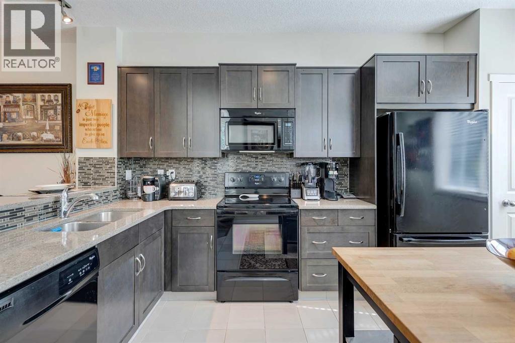 8 Kinlea Common Nw, Calgary, Alberta  T3K 3Z5 - Photo 3 - A2259897