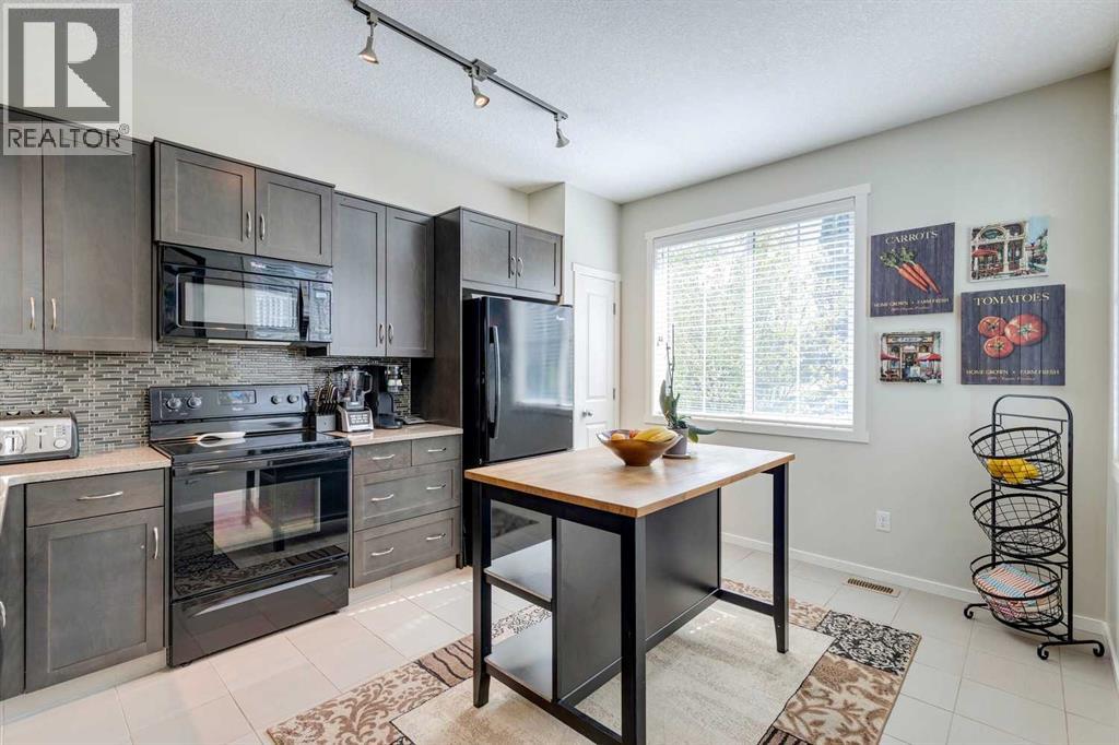 8 Kinlea Common Nw, Calgary, Alberta  T3K 3Z5 - Photo 2 - A2259897
