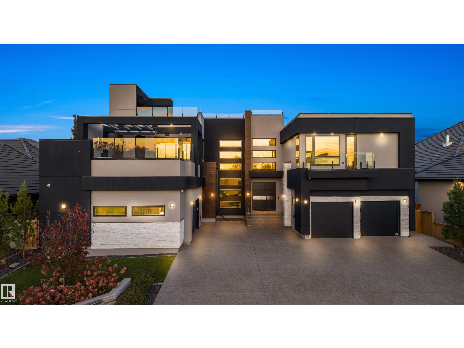 17 Windermere Dr Sw  Edmonton, Alberta THIS IS MORE THAN A HOME - IT’S A STATEMENT. Perched on coveted WINDERMERE DRIVE, this architectural marvel delivers OVER 6,500 SQFT OF EXQUISITE LIVING SPACE—a bold fusion of design, luxury, and lifestyle. Boasting 4 BEDROOMS, 6 BATHROOMS, and TWO SHOW-STOPPING ROOFTOP PATIOS—one with a SWIM SPA OVERLOOKING THE RIVER.  SOARING CEILINGS and OPEN-CONCEPT DREAM layout, with a sleek COFFEE BAR LOUNGE that sets the tone for sophistication. The chef’s kitchen dazzles with MIELE APPLIANCES, SNEIDERO CABINETS and a SECOND FULL PREP KITCHEN. The FLOATING STAIRCASE guides you to the luxe primary suite, complete with a SPA-INSPIRED ENSUITE, and a JAW-DROPPING WALK-IN CLOSET. Exceptional features abound: TEMPERATURE-CONTROLLED WINE CELLAR, SPAIN PORCELAIN TILE, STEAM SHOWER, HOME GYM, THREE ECOSMART FIREPLACES, LUTRON SMART LIGHTING & SONOS SOUND SYSTEM, IN-FLOOR HEATING ON EVERY LEVEL, DUAL DOUBLE GARAGES WITH EPOXY FLOORS, SOLAR PANELS, COVERED DECK WITH BUILT-IN SCREENS, and $270,000 IN AWARD-WINNING LANDSCAPING. (id:48254)