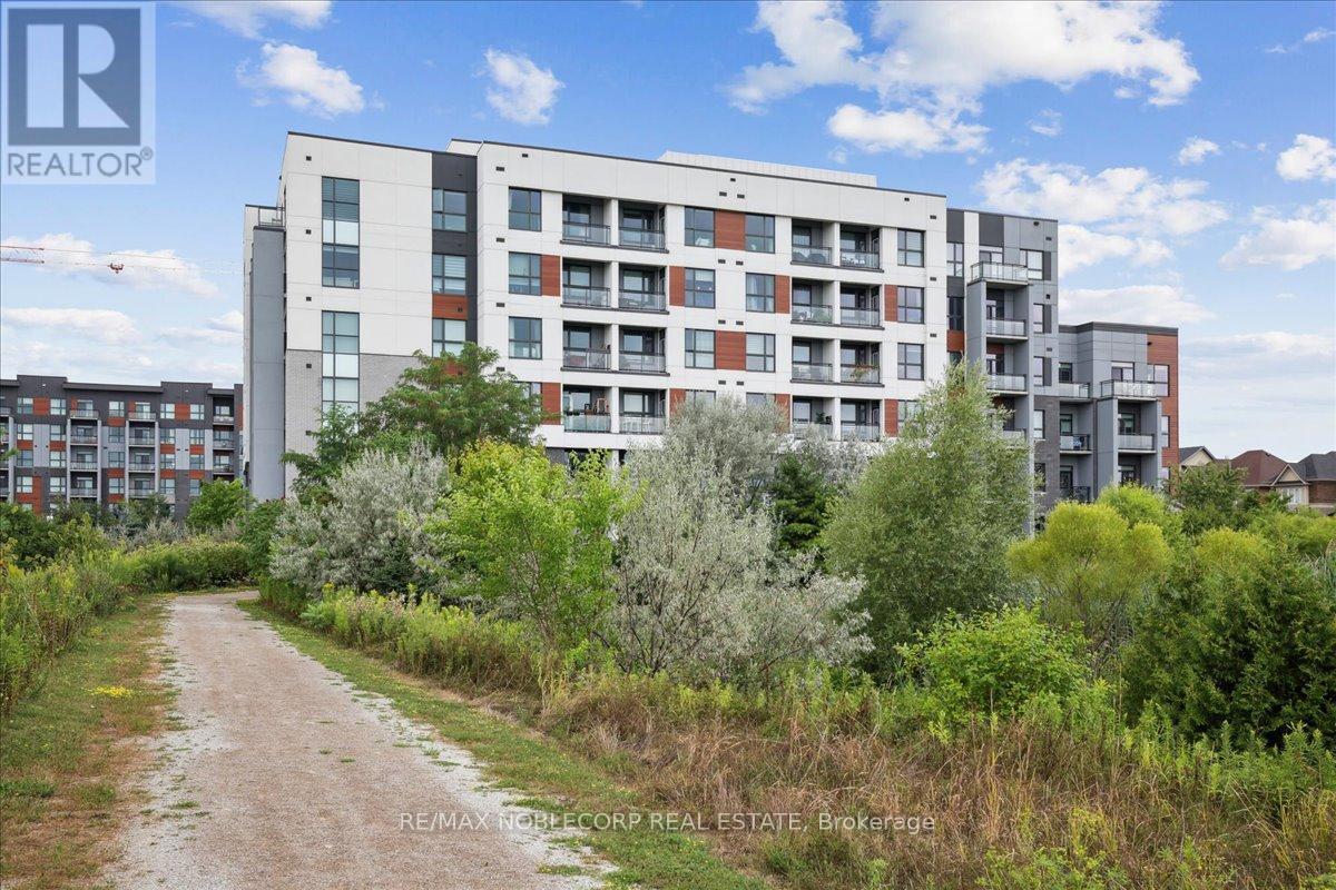 516 - 50 Kaitting Trail, Oakville, Ontario  L6M 4L9 - Photo 3 - W12427145