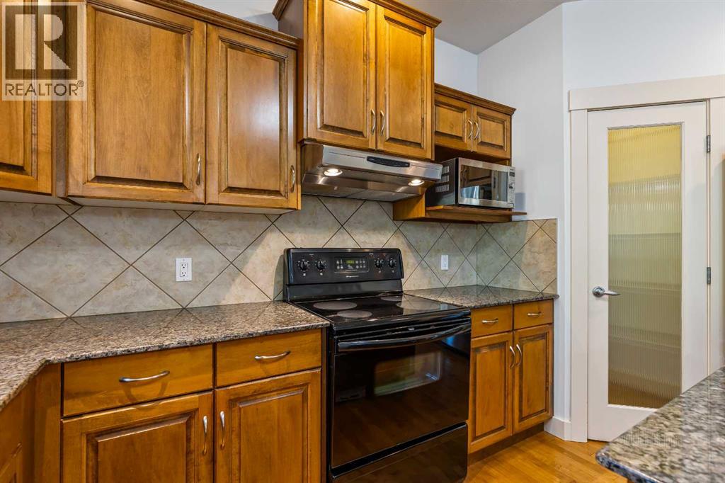 68 Elmont Court Sw, Calgary, Alberta  T3H 5Z8 - Photo 14 - A2246175