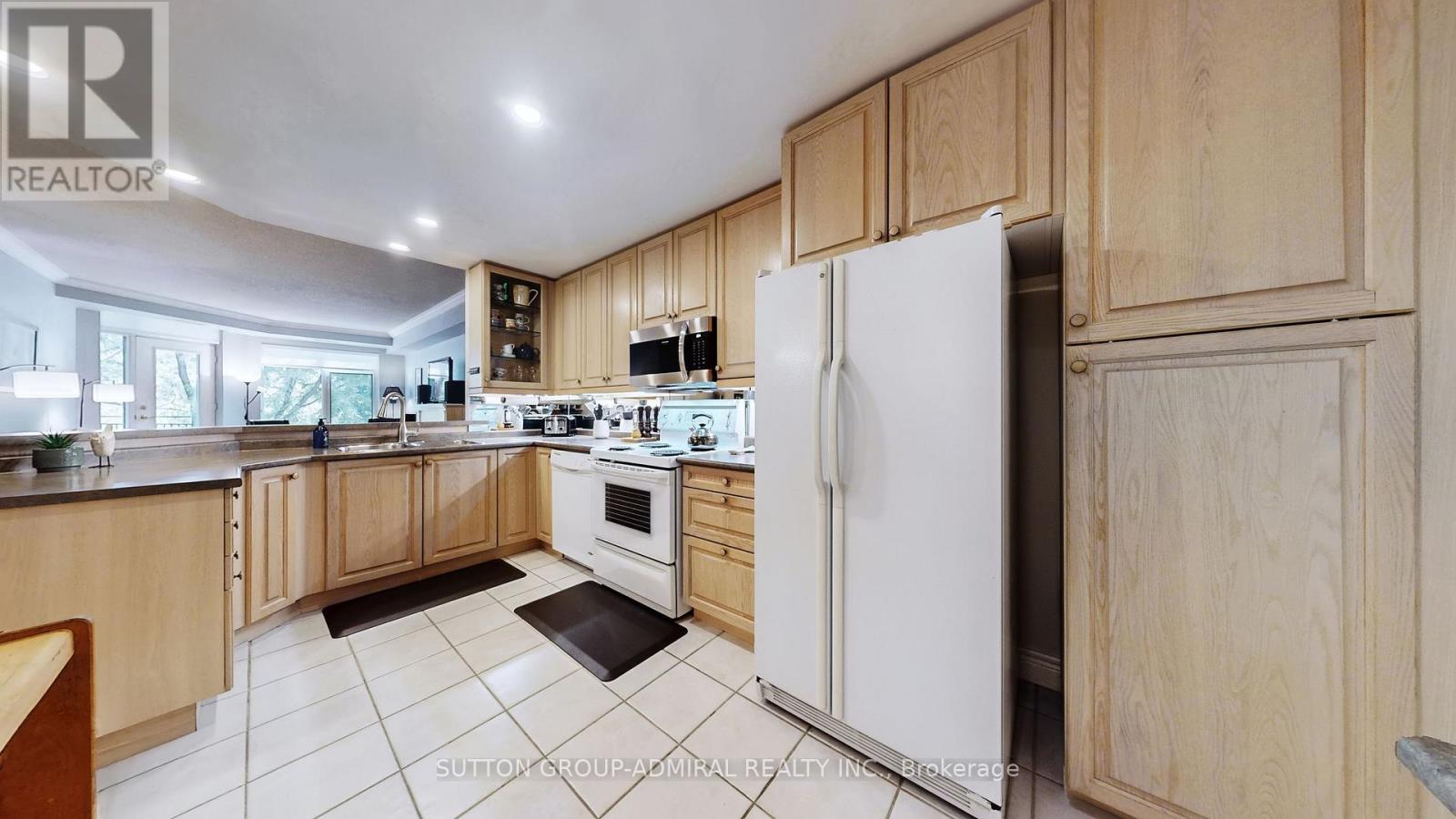 207 - 10 Old Mill Trail, Toronto, Ontario  M8X 2Y9 - Photo 18 - W12419476