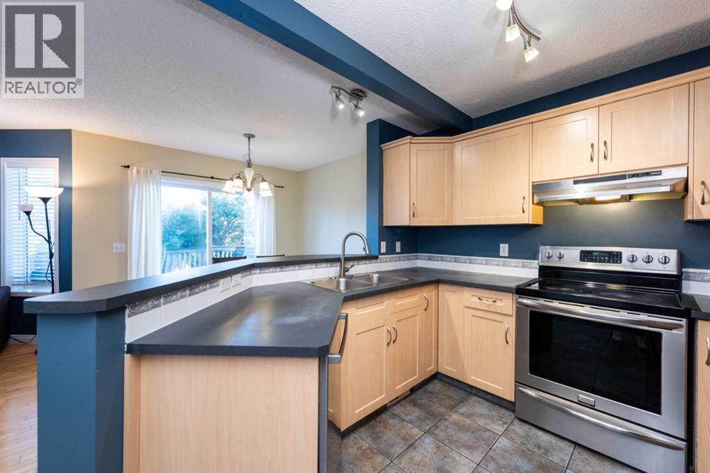 49 Rocky Ridge Heath Nw, Calgary, Alberta  T3G 4Z7 - Photo 5 - A2259925