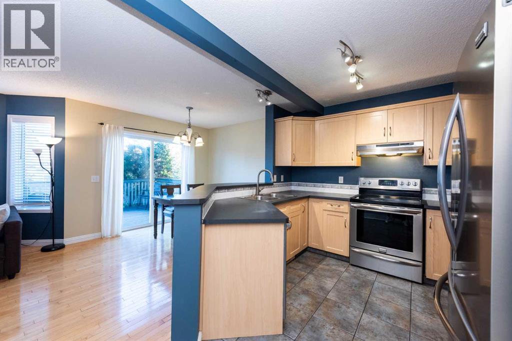 49 Rocky Ridge Heath Nw, Calgary, Alberta  T3G 4Z7 - Photo 4 - A2259925