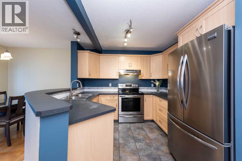 49 Rocky Ridge Heath Nw, Calgary, Alberta  T3G 4Z7 - Photo 3 - A2259925