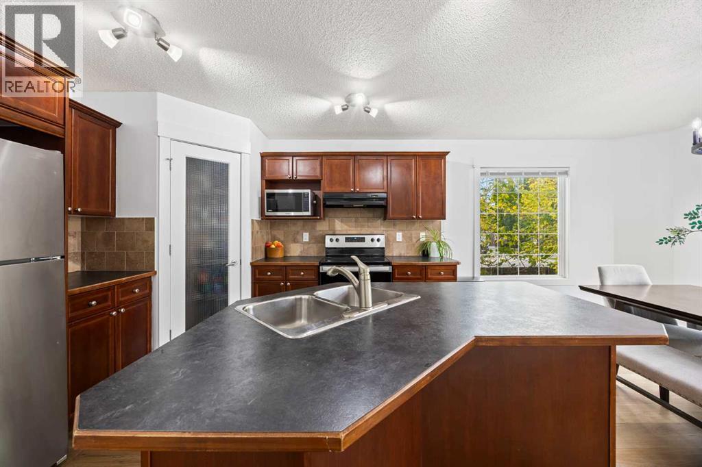 93 Crystal Shores Heights, Okotoks, Alberta  T1S 2K9 - Photo 8 - A2253422