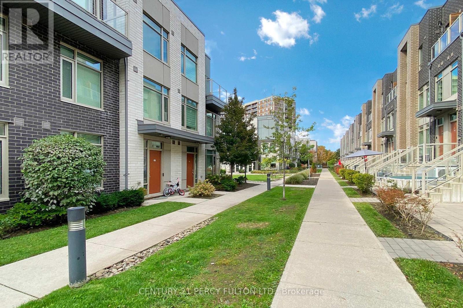 93 - 15 Applewood Lane, Toronto, Ontario  M9C 2Z7 - Photo 2 - W12431261