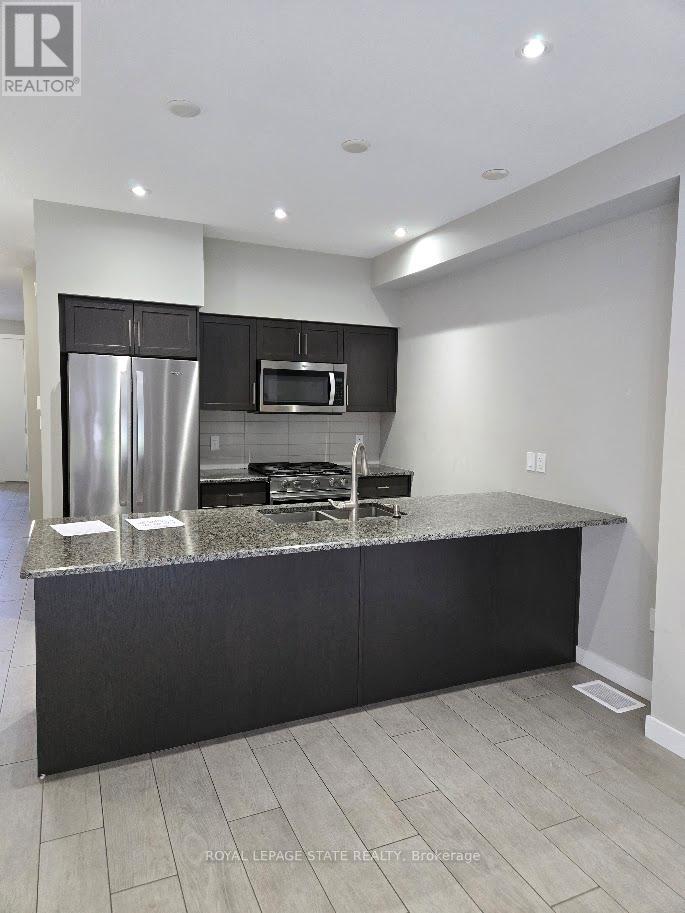 940 Robert Ferrie Drive, Kitchener, Ontario  N2R 0P9 - Photo 6 - X12431839