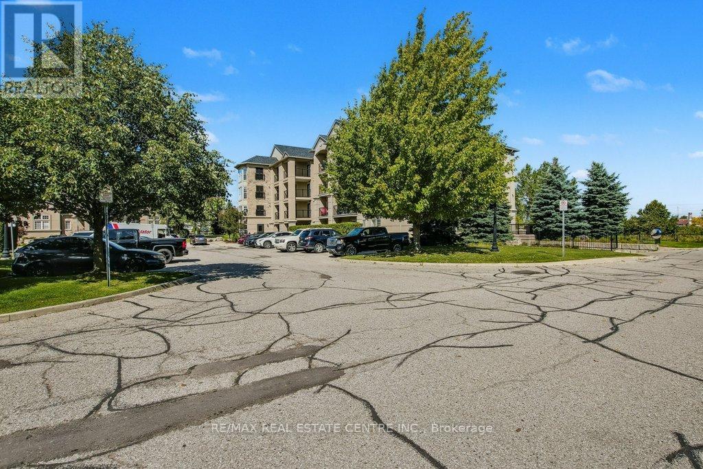 407 - 1479 Maple Avenue, Milton, Ontario  L9T 0B5 - Photo 2 - W12432089